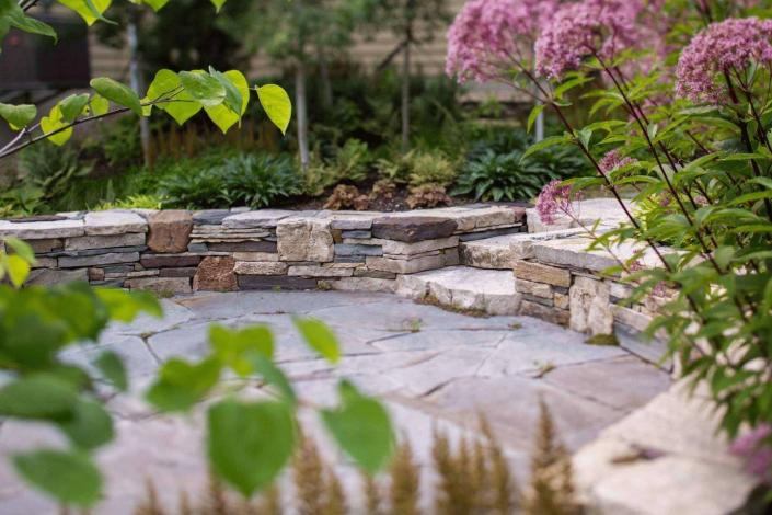 By adding stone structures and designs, you can enhance the aesthetic of your property.